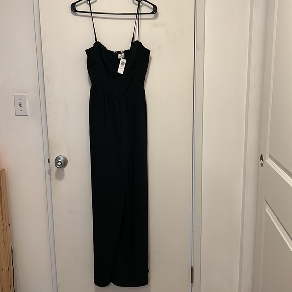This is a jumpsuit with a lined bodice, sweetheart neckline with a ruffled trim. - Picture 5 of 5